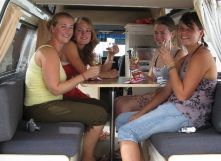 Inside a Used Toyota Campervans for sale Sydney - four lovely girls drinking wine