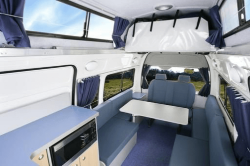 Inside the lounge area of a Toyota Hiace Automatic Campervan