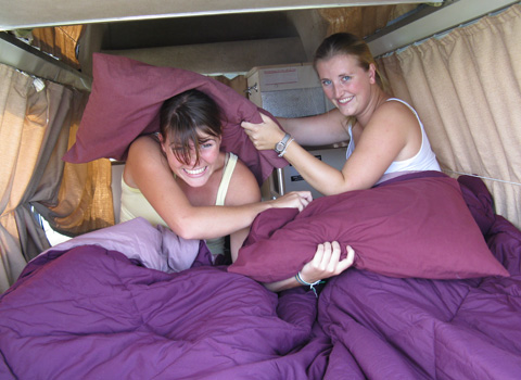 Two lovely girls in the back of the bed in this Used Toyota Campervans for sale Sydney