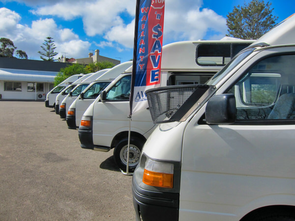 Toyota Hiace Campervans for sale at our sydney depot - view of ten campers for sale in a row at depot