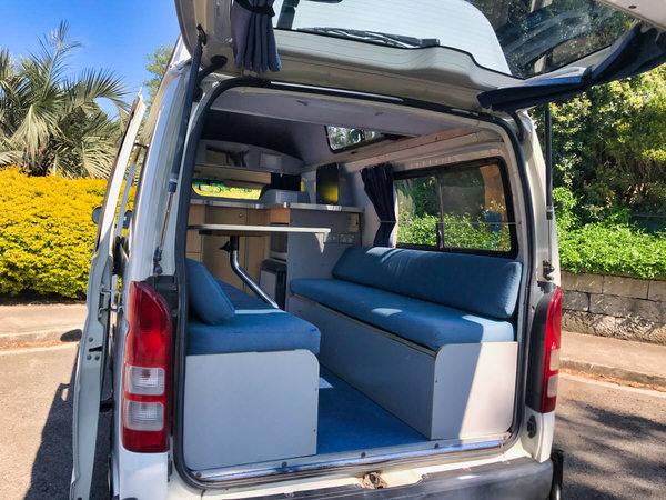 Toyota Hiace Ex-hire Campervan for Sale in Sydney - photo of the lounge area with two benches and table